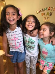 VPK/Pre-K girls laughing together at school.